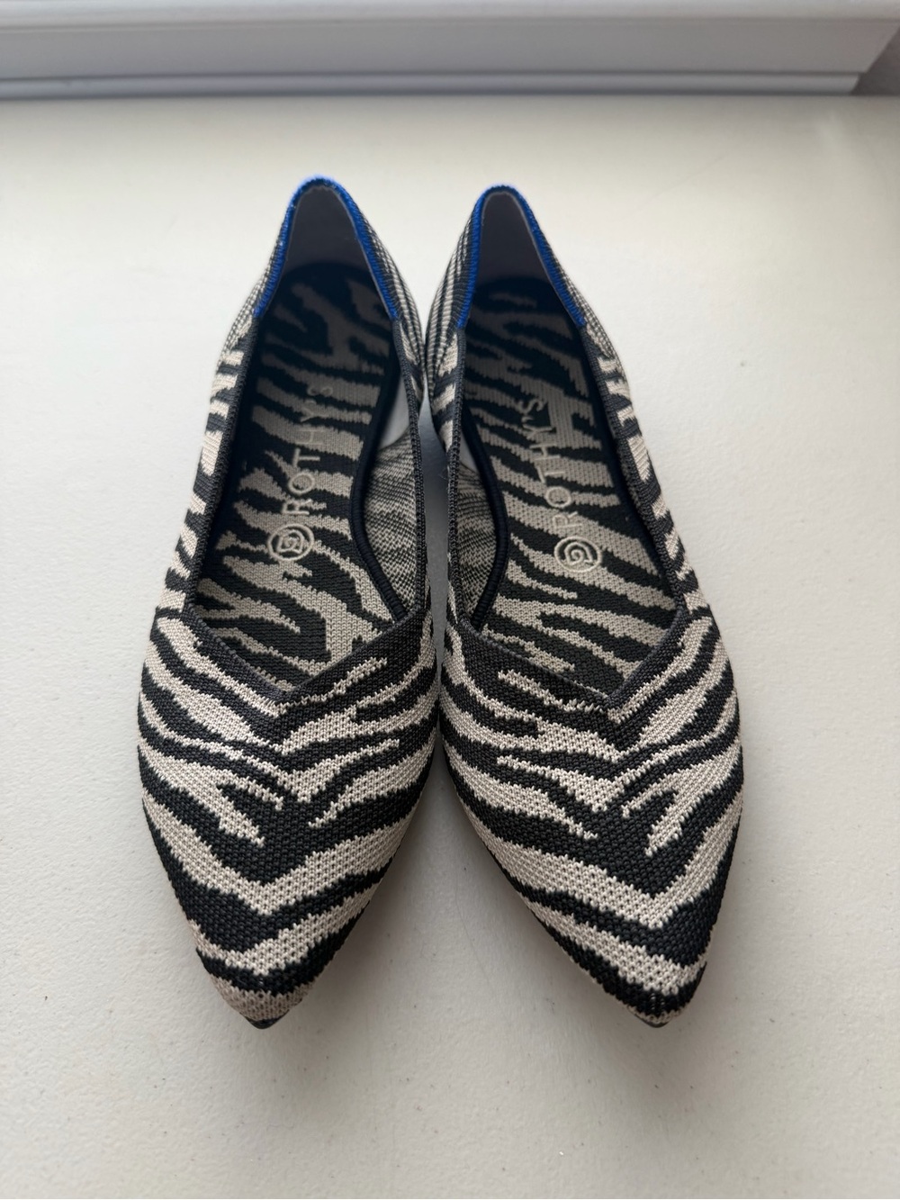Rothy’s Pointed Zebra Print Knit Ballet Flat in Black & Cream